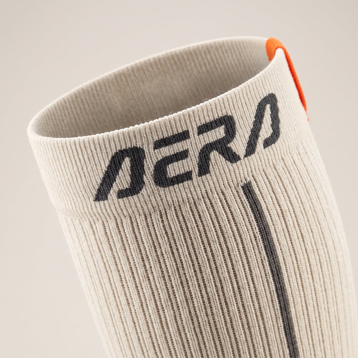 AERA Off White Ember compression running sock – closeup
